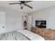Bedroom with ceiling fan and natural light, dresser and door leading to another room at 2643 Herndon Nw Rd, Lawrenceville, GA 30043