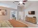 Spacious main bedroom features neutral tones, ceiling fan, and an en-suite bathroom entrance at 2643 Herndon Nw Rd, Lawrenceville, GA 30043