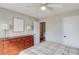 Cozy bedroom featuring neutral tones, with ample closet space, and ceiling fan at 2643 Herndon Nw Rd, Lawrenceville, GA 30043