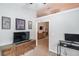 This room features a TV, an entertainment center and an entrance to another room at 2643 Herndon Nw Rd, Lawrenceville, GA 30043