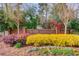 Beautiful community entrance with lush landscaping and brick signage at 2643 Herndon Nw Rd, Lawrenceville, GA 30043