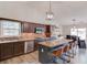 Well-appointed kitchen with stainless steel appliances, granite countertops, and an island with seating, blending style and functionality at 2643 Herndon Nw Rd, Lawrenceville, GA 30043