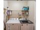 Functional laundry room features modern washer and dryer, with practical shelving at 2643 Herndon Nw Rd, Lawrenceville, GA 30043