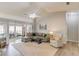 Spacious living room with vaulted ceiling, ceiling fan, ample seating, and a sunroom at 2643 Herndon Nw Rd, Lawrenceville, GA 30043