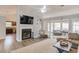 Open living space with a fireplace, and a view into the kitchen and sunroom at 2643 Herndon Nw Rd, Lawrenceville, GA 30043