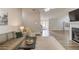 Inviting living room with a neutral color palette, fireplace, and seamless flow into the entry, ideal for modern living at 2643 Herndon Nw Rd, Lawrenceville, GA 30043