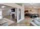 Open-concept living area showcasing a fireplace, modern flooring, and seamless transition to the kitchen for easy entertaining at 2643 Herndon Nw Rd, Lawrenceville, GA 30043