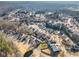 Vast aerial shot of a peaceful neighborhood surrounded by trees, showcasing the community's layout at 416 Pine Log Ct, Canton, GA 30115
