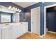 Bathroom featuring double vanity, cabinet space, and lots of natural light at 416 Pine Log Ct, Canton, GA 30115