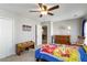 Well-lit bedroom featuring neutral walls, carpet, fan, and natural light from a window at 416 Pine Log Ct, Canton, GA 30115