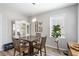 Cozy dining nook with natural light, wooden table, and charming decorative accents at 416 Pine Log Ct, Canton, GA 30115