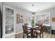 Eat-in dining area with neutral decor, a wooden table and chairs and a display cabinet at 416 Pine Log Ct, Canton, GA 30115