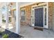 Inviting front porch with rocking chairs and a 'Home Sweet Home' welcome mat at 416 Pine Log Ct, Canton, GA 30115