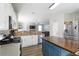 Open-concept kitchen with stainless steel appliances and a large island open to living area at 416 Pine Log Ct, Canton, GA 30115