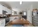 Spacious open kitchen featuring an island, stainless steel appliances, and view to living space at 416 Pine Log Ct, Canton, GA 30115