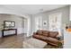 Comfortable living room with natural light and a leather sofa at 416 Pine Log Ct, Canton, GA 30115