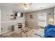 Cozy living room featuring comfortable seating, a ceiling fan, and a wall-mounted TV at 416 Pine Log Ct, Canton, GA 30115