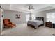 Spacious main bedroom featuring tray ceilings, a ceiling fan, carpet, and ensuite bathroom at 416 Pine Log Ct, Canton, GA 30115