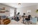 Home office with exercise equipment, desk, shelving, and comfortable furniture at 416 Pine Log Ct, Canton, GA 30115