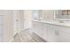 Bathroom featuring tile floors, double vanity with quartz countertops, and custom cabinets at 508 Sutters Mill Rd, Stone Mountain, GA 30087