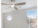 Bedroom featuring large windows providing natural light, and a ceiling fan at 508 Sutters Mill Rd, Stone Mountain, GA 30087