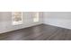 View of a bedroom featuring updated flooring, modern trim, and natural light at 508 Sutters Mill Rd, Stone Mountain, GA 30087