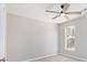 Bedroom featuring large windows providing natural light, and a ceiling fan at 508 Sutters Mill Rd, Stone Mountain, GA 30087