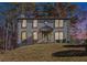 Attractive two-story home featuring a symmetrical facade and a well-maintained front lawn at 508 Sutters Mill Rd, Stone Mountain, GA 30087