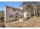 Backyard of two-story home featuring wooden deck and wooded backdrop at 508 Sutters Mill Rd, Stone Mountain, GA 30087