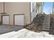 View of a two-car garage and steps leading up to the house at 508 Sutters Mill Rd, Stone Mountain, GA 30087