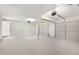 Spacious three-car garage with new doors, opener, and freshly painted floor at 508 Sutters Mill Rd, Stone Mountain, GA 30087