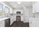 Bright kitchen featuring stainless steel appliances, white cabinets, and modern countertops at 508 Sutters Mill Rd, Stone Mountain, GA 30087
