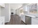Open-concept living room with fireplace, wood floors, and lots of natural light at 508 Sutters Mill Rd, Stone Mountain, GA 30087