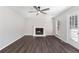 Cozy living room showcasing fireplace, new flooring, and an exterior door to the outside at 508 Sutters Mill Rd, Stone Mountain, GA 30087