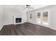 Spacious living room showcasing fireplace, hardwood floors, and a set of French doors at 508 Sutters Mill Rd, Stone Mountain, GA 30087