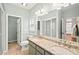 Well-lit bathroom features a double sink vanity with granite countertops, a shower, and a separate toilet room at 5500 Mccoy Nw Rd # 15, Acworth, GA 30101