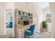 This charming home office has a built-in desk, storage shelves, and view to the outdoors at 5500 Mccoy Nw Rd # 15, Acworth, GA 30101