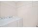This practical laundry room includes a washer, a dryer and wire shelving for convenient storage at 5500 Mccoy Nw Rd # 15, Acworth, GA 30101