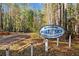 Allatoona Boat & Ski members-only sign with wooded landscape shows the great lifestyle this property offers at 5500 Mccoy Nw Rd # 15, Acworth, GA 30101