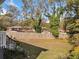 Large backyard is framed by a wood fence and mature trees at 2742 Oakland Ter, Decatur, GA 30032