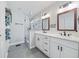 Beautiful bathroom with double sink vanity, walk-in shower and stylish tile floors at 2742 Oakland Ter, Decatur, GA 30032