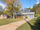 Charming single-story home with a well-manicured lawn and a cozy front porch at 2742 Oakland Ter, Decatur, GA 30032