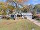 Charming single-story home with inviting curb appeal and mature trees at 2742 Oakland Ter, Decatur, GA 30032