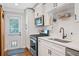 Renovated kitchen with stainless steel appliances, subway tile backsplash, and a cozy breakfast nook at 2742 Oakland Ter, Decatur, GA 30032