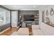 Spacious living room with hardwood flooring, large windows, and modern decor at 2742 Oakland Ter, Decatur, GA 30032