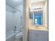 Well-lit bathroom featuring a shower-tub combination and a vanity with ample cabinet space at 408 Smokerise Se Cir, Marietta, GA 30067