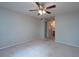 Carpeted bedroom with ceiling fan and view to the en-suite bath at 408 Smokerise Se Cir, Marietta, GA 30067
