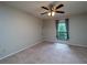 Bedroom with natural light, ceiling fan and neutral carpeting at 408 Smokerise Se Cir, Marietta, GA 30067