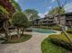 Community pool surrounded by lush greenery and trees at 408 Smokerise Se Cir, Marietta, GA 30067