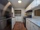 Updated kitchen featuring stainless steel appliances and in-unit laundry area at 408 Smokerise Se Cir, Marietta, GA 30067